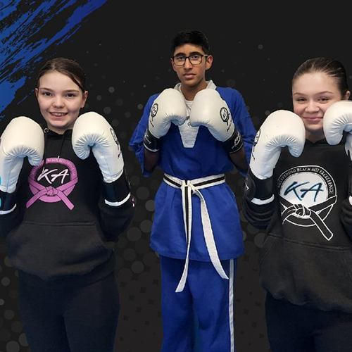 Kane Academy, ThreeTeenage Kickboxers wearing white boxing gloves