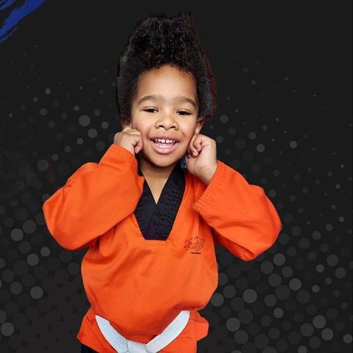 Tiny Tigers Martial Arts Child aged 4-7 wearing orange uniform