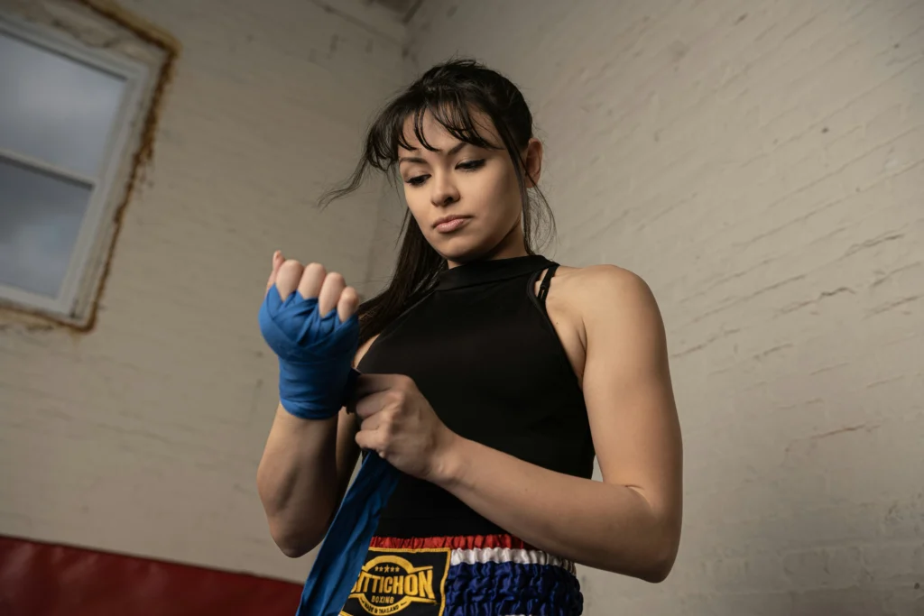 A woman getting ready for a fitness kickboxing class online